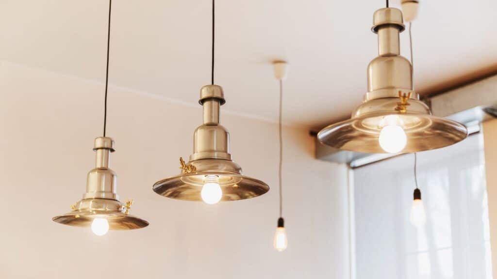 Industrial-style metal pendant lights with exposed bulbs create a modern aesthetic to elevate your home decor.