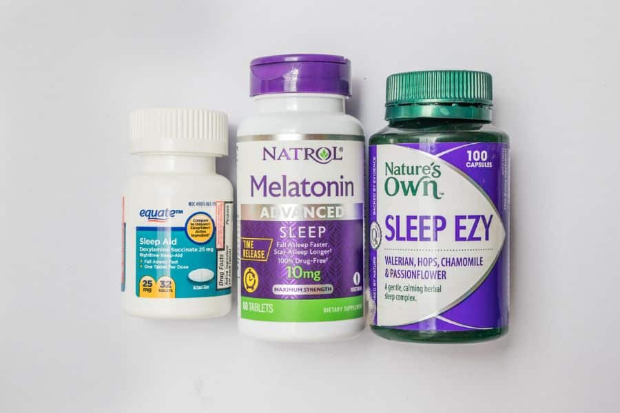 Three sleep supplements side by side, including Equate Sleep Aid, Natrol Melatonin, and Nature’s Own Sleep Ezy. These over-the-counter sleep aids reflect nightly rituals that rewind the clock on aging by promoting deep rest.