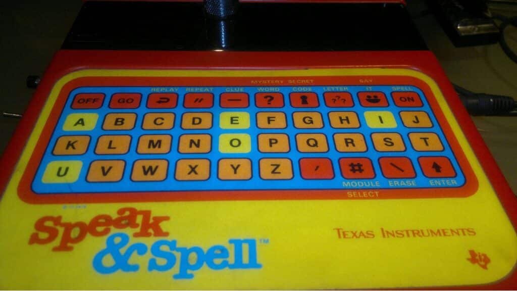 A close-up of the Speak & Spell electronic toy with a colorful keyboard of letters and functions. Created by Texas Instruments, it helped kids learn and spell as one of the most educational childhood toys from the 70s.