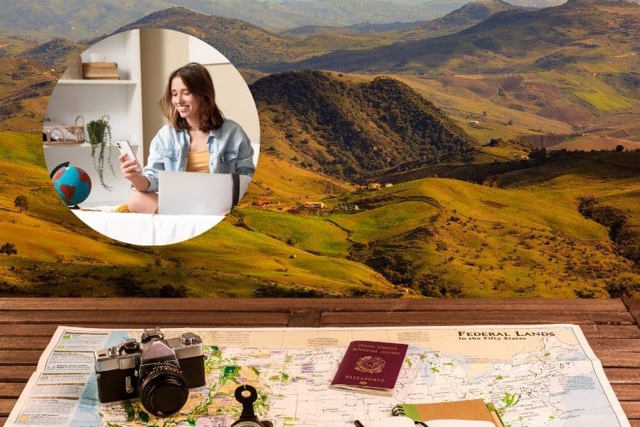 A flat lay of a travel map, camera, passport, and keys with a scenic mountain view in the background, and a circular inset of a woman using her phone and laptop indoors. This visual illustrates how AI Plan My Vacation enables users to organize travel from home with ease.