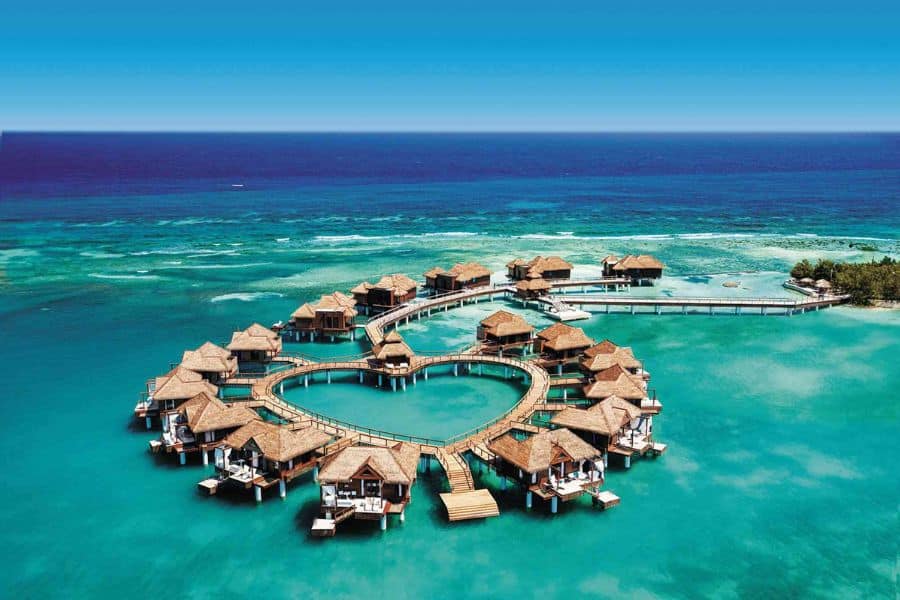 A Maldives resort with a heart style shape with huts