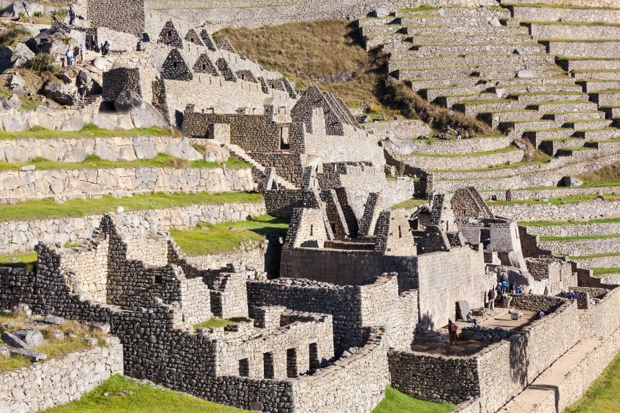 Close-up view of ancient Incan stone ruins and agricultural terraces at Machu Picchu, Peru. Rich in history and mystery, this UNESCO World Heritage site is a classic among Bucket List Destinations to Visit.