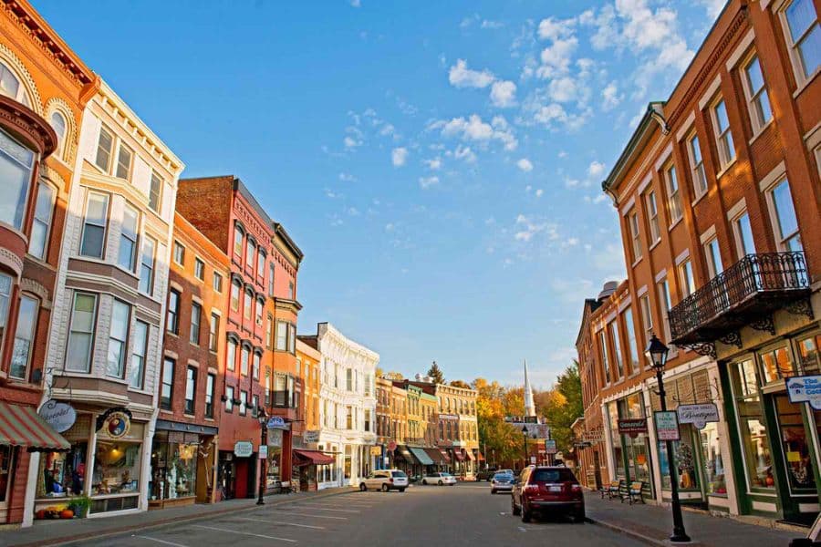 Colorful row of preserved storefronts and vintage architecture along a charming downtown street in historic American towns.