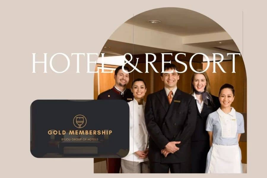 Hotel staff in uniform smiling at the camera, with a "Gold Membership" card and the words "Hotel & Resort" in the background. Loyalty programs and membership perks are often overlooked Hacks For Getting Cheaper Vacations.