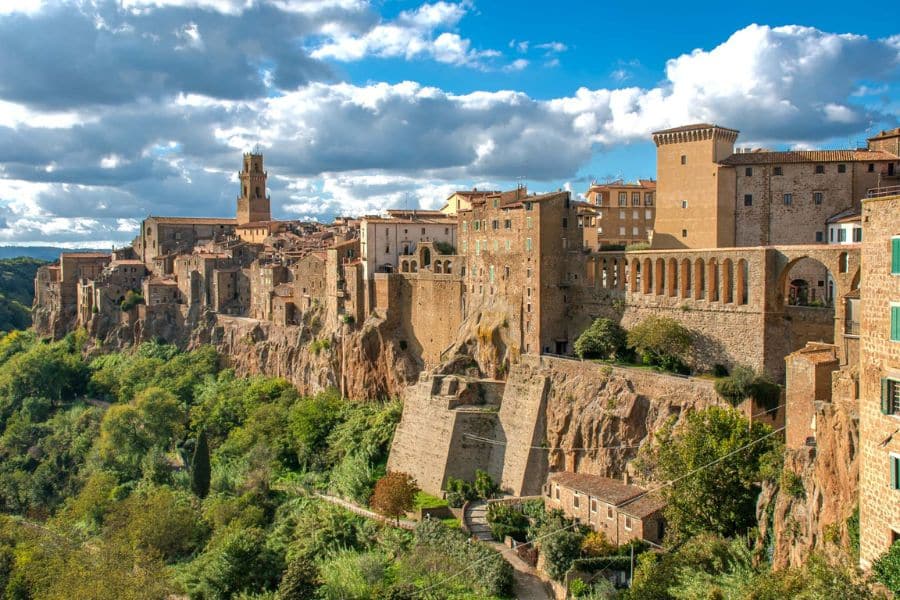 Dramatic cliffside town with stone architecture and sweeping countryside views featuring ancient villages in Italy.