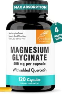 Black supplement bottle on a white background labeled "MAX ABSORPTION" "Third Party Lab Tested" "Research Based Nutrition" "Gluten, Soy and Dairy Free" "Sandhus Nutrition" "MAGNESIUM GLYCINATE" "400 mg per capsule" "With added Quercetin" "120 Capsules" "DIETARY SUPPLEMENT" and "4 MONTH SUPPLY." A single yellow capsule lies beside the bottle.