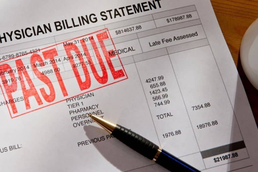 Physician billing statement marked with a large red "PAST DUE" stamp. A pen points at medical charges on the bill, illustrating debt when you die and unpaid healthcare expenses.