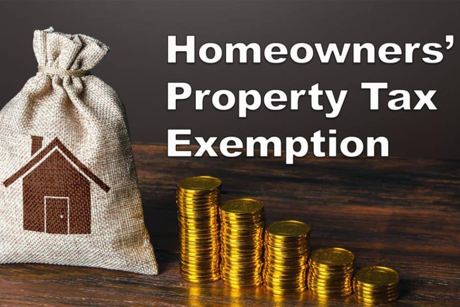 Money bag with a house icon beside stacks of coins and text that says "Homeowners Property Tax Exemption".