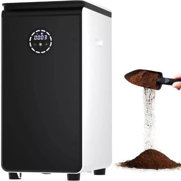 A black and white electric compost machine stands beside a scoop pouring dark processed compost material onto a small pile. The circular digital display reads "0003".