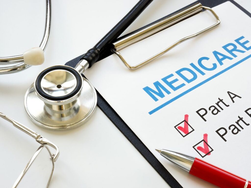 A stethoscope pen and eyeglasses sit beside a form reading "MEDICARE" with "Part A" and "Part B" checked. The scene connects Roth conversion planning with Medicare costs that can be affected by higher taxable income.
